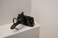 Kaboompics - Black Woven Heel and Ruched Handbag on White Shelf