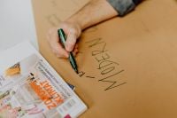 Kaboompics - Man hand holding a green marker pen