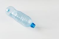 Kaboompics - Translucent Blue Plastic Bottle Lying on White