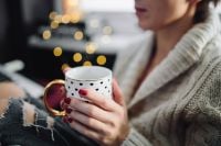 Kaboompics - Woman drinking hot tea in her home office