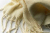 Kaboompics - Cream Fringed Scarf Close Up for Soft Winter Aesthetic