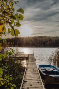 Kaboompics - Wooden Dock and Rowboats on a Lake at Autumn Sunset
