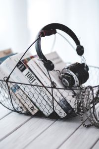Kaboompics - Close View of Headset beside Printed Pages in a Basket