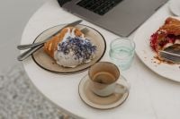 Kaboompics - Coffeehouse Work Table with Laptop, Pastries and Espresso
