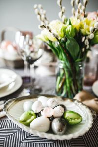 Kaboompics - Round dinner table decorated with easter motifs