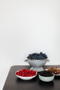 Kaboompics - Berries on a Dark Counter With White Background