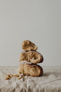 Kaboompics - Stack of Three Bread Pieces on Linen