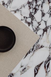 Kaboompics - Neutral Tabletop Styling with Black Ceramic Bowl and Marble Surface