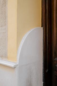 Kaboompics - Arched Plaster Detail beside Wooden Door
