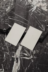 Kaboompics - Two Blank Business Cards Side by Side on Black Marble, Portrait Mockup