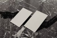 Kaboompics - Two Blank Vertical Business Cards Angled Across Black Marble, Horizontal Mockup