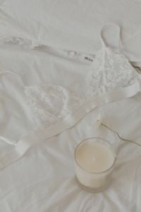 Kaboompics - White Lace Triangle Bra with a Candle