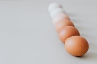Kaboompics - White and Brown Eggs in a Diagonal Line with Copy Space, Minimal Easter Food Background
