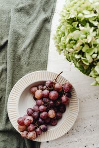 Kaboompics - Hydrangea Flowers and Red Grapes in a Soft Still Life
