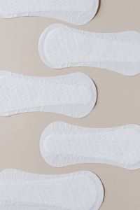 Kaboompics - Cropped White Sanitary Pads Forming a Textural Pattern on Beige