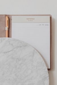 Kaboompics - Rose Gold Pen and Lined Notepad with Marble Surface for Planner Mockups