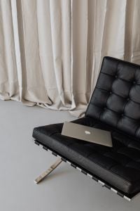 Kaboompics - Laptop on Black Leather Chair with Neutral Office Copy Space