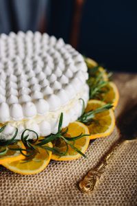 Kaboompics - Meringue Cake with whipped cream and oranges
