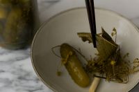 Kaboompics - Pickle with Dill and Bay Leaves in a Ceramic Bowl, Close-Up