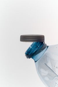 Kaboompics - Plastic Bottle With Open Cap Minimal Background