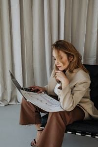 Kaboompics - Seated Businesswoman Working on a Laptop in a Neutral Home Office