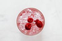 Kaboompics - Overhead Raspberries Floating In Ice