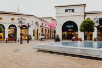 Kaboompics - Designer Outlet Courtyard with Fountain and Green Umbrellas