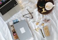 Kaboompics - Overhead Home Office Setup With Laptop, Planner, Glasses And Jewelry