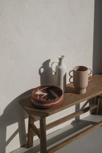 Kaboompics - Wooden Bench with Ceramic Bowl, Vase and Sculptural Mug in Sunlight