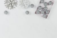 Kaboompics - Silver Baubles in a Gift Tray on White Marble Christmas Background