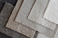 Kaboompics - Black Bouclé Upholstery Fabric Swatches on Gray Stone