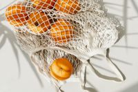 Kaboompics - Close-Up of Oranges in a Cotton Mesh Grocery Bag with Long Handles