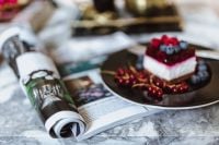 Kaboompics - Cheesecake and magazine on a marble table