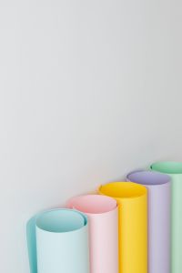 Kaboompics - Pastel Paper Rolls Along the Lower Right Edge with Copy Space