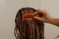 Kaboompics - Woman Combing Wet Hair from Behind