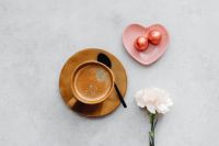 Kaboompics - Coffee Cup With Heart Chocolates and White Flower