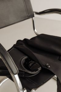 Kaboompics - Black Blazer, Handbag and Sunglasses on Chrome Chair