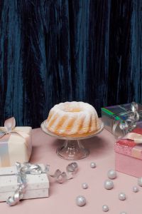 Kaboompics - Bundt Cake and Christmas Gifts on Pink Table