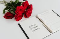 Kaboompics - March Planner with Red Roses and Believe in Your Dreams Desk Inspiration