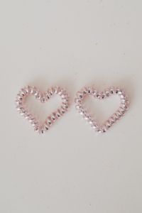 Kaboompics - Two Pink Beaded Heart Shapes on Speckled Beige Surface, Vertical Valentine Flat Lay