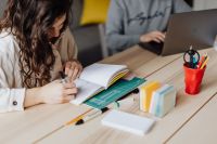 Kaboompics - Woman Taking Notes Beside Man Using Laptop