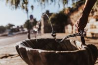 Kaboompics - Drinking fountain with stream of water on the sidewalk
