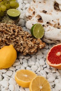 Kaboompics - Colorful Citrus Still Life on Natural Stone and White Pebbles