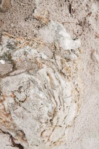 Kaboompics - Weathered White Limestone with Shallow Grooves and Rounded Erosion Pits, Natural Stone Background