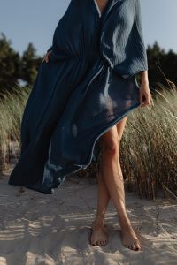 Kaboompics - Barefoot Woman in Blue Kaftan Dress on Sand Dunes