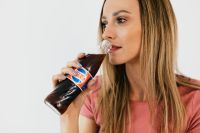 Kaboompics - Young woman with Pepsi Cola bottle