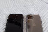 Kaboompics - Black and Silver Phone Cameras on White Ridged Surface, Close Crop