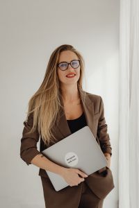 Kaboompics - Editorial Portrait of Female Design Consultant With Laptop