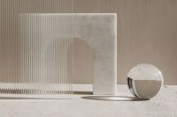 Kaboompics - Minimalist Abstract Background with Glass Sphere and Ribbed Panel