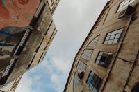 Kaboompics - Looking Up between Weathered Industrial Factory Buildings at LX Factory, Lisbon Portugal, Architectural Detail